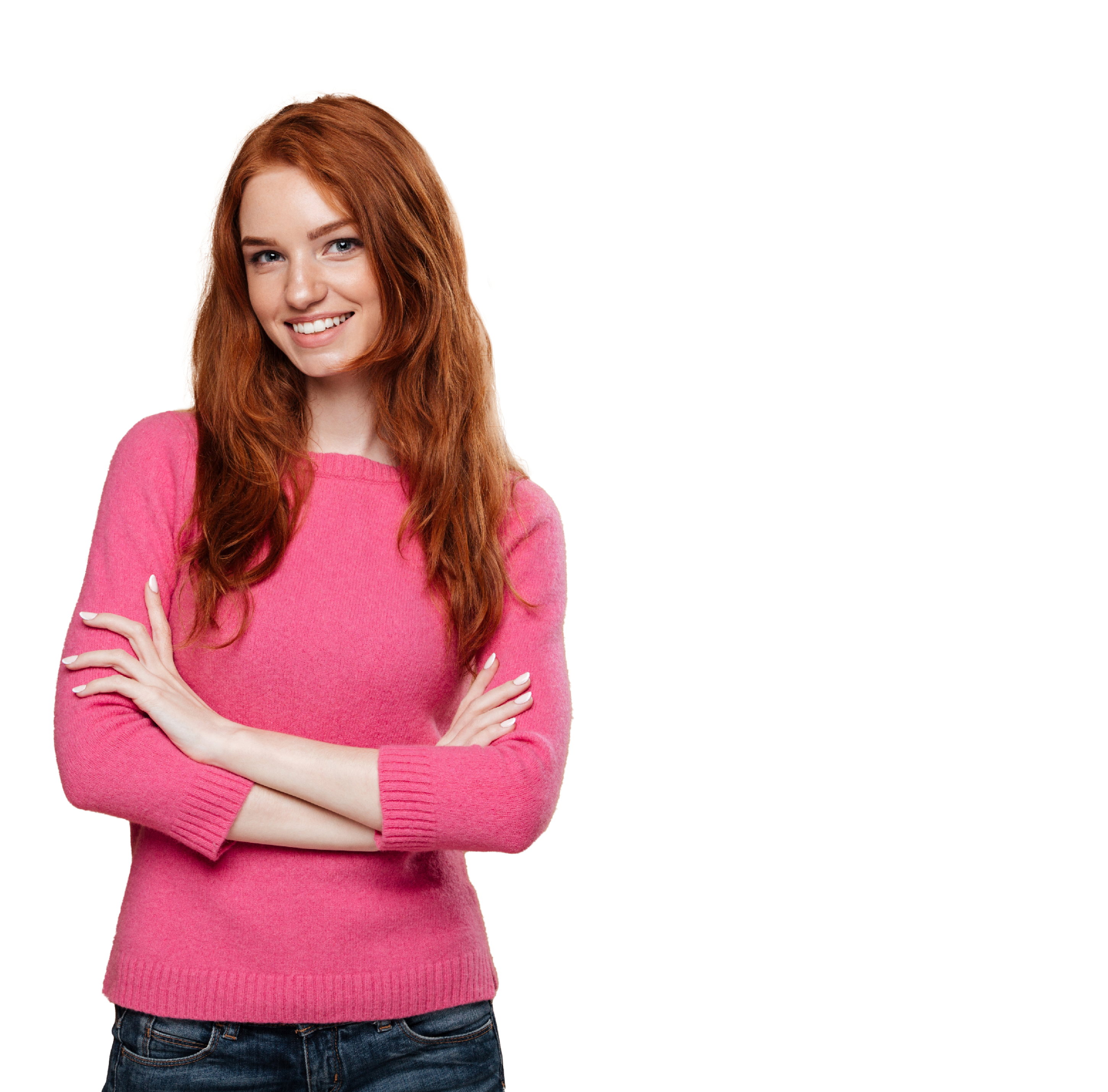 Portrait of a young smiling redhead girl standing with arms folded and looking at camera isolated over beige background